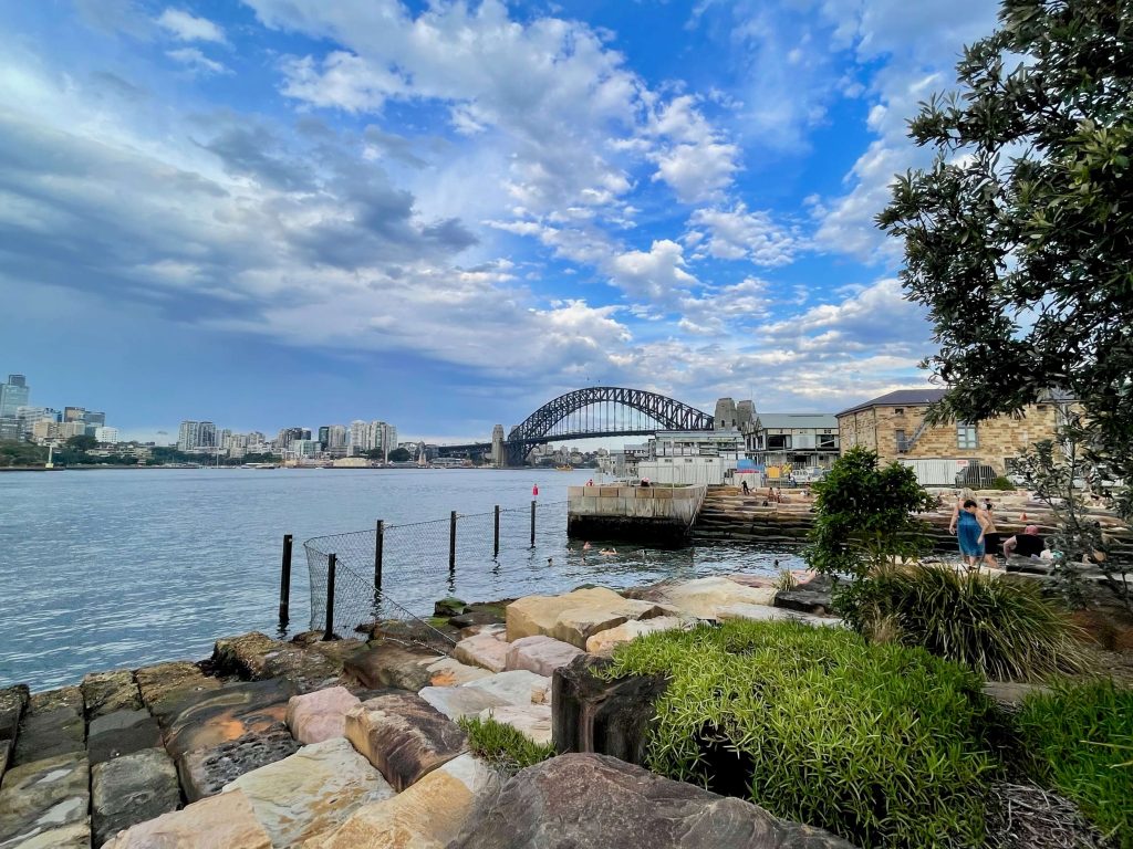 101 Outdoor Activities in Sydney A view of the Sydney Harbour Bridge from Marrinawi Cove swim area at the Barangaroo foreshore