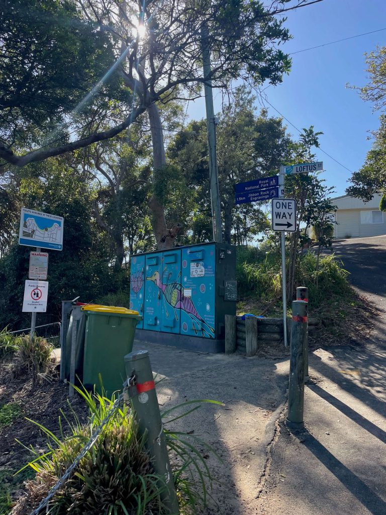 Jibbon Track in Royal National Park Signs marking the entry to the National Park and Jibbon Beach